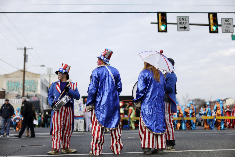 Mummers wait for the start of the annual New Year's Day parade, Wednesday, Jan. 1, 2014, in Philadelphia. (AP Photo/Matt Rourke)