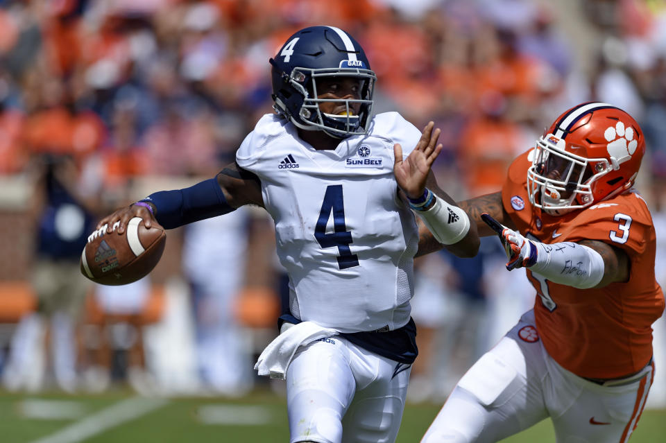 Georgia Southern quarterback Shai Werts (4) is pressured by Clemson's Xavier Thomas during the first half of an NCAA college football game Saturday, Sept. 15, 2018, in Clemson, S.C. (AP Photo/Richard Shiro)