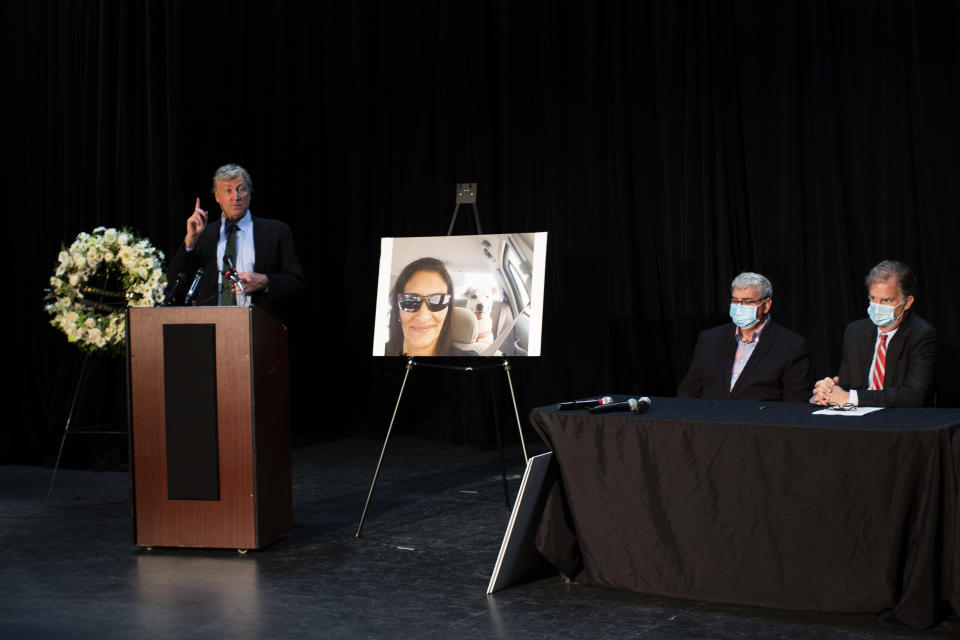 Mike Doyle, left, John Nicholas, center, and Charles Bourque attend a press conference, Thursday, Jan. 28, 2021, in Houston. John Nicholas is the brother of Rhogena Nicholas who was killed in a botched drug raid two years ago. The families of a couple killed in a 2019 drug raid by Houston police have alleged in newly filed lawsuits that the deaths of their loved ones were the tragic result of a narcotics unit that for years was rife with corruption and no accountability and now has many of its members under indictment. (Marie D. De Jesús/Houston Chronicle via AP)