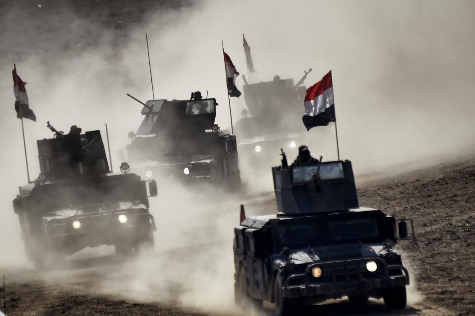 Iraqi troops advance towards Mosul's on February 24, 2017 during an ongoing offensive to retake the northern city from jihadists of the Islamic State group Iraqi forces entered west Mosul neighbourhoods, a key stronghold in the shrinking "caliphate" of the Islamic State group, which replied with deadly suicide attacks in Iraq and Syria. (Aris Messinis/AFP via Getty Images)