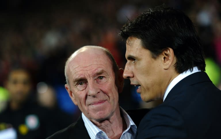 Roger Speed, father of the late Gary Speed, is embraced by new Wales manager Chris Coleman before the Gary Speed Memorial Match in Cardiff in February 2012