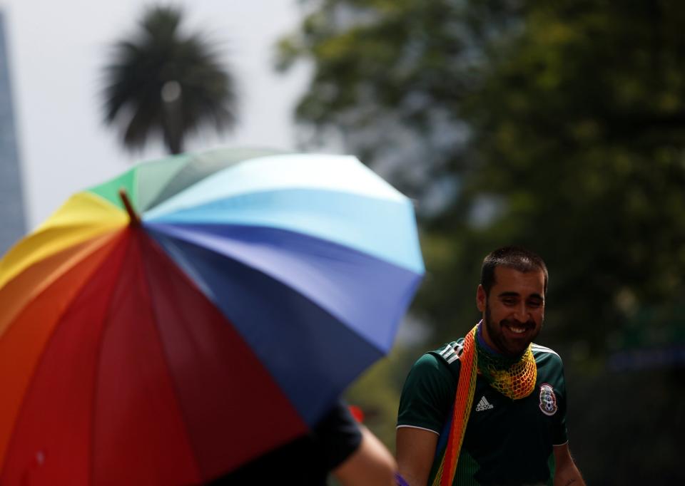 While some supporters could be seen waving rainbow flags, others brandished Mexican flags, and some even sported both: REUTERS