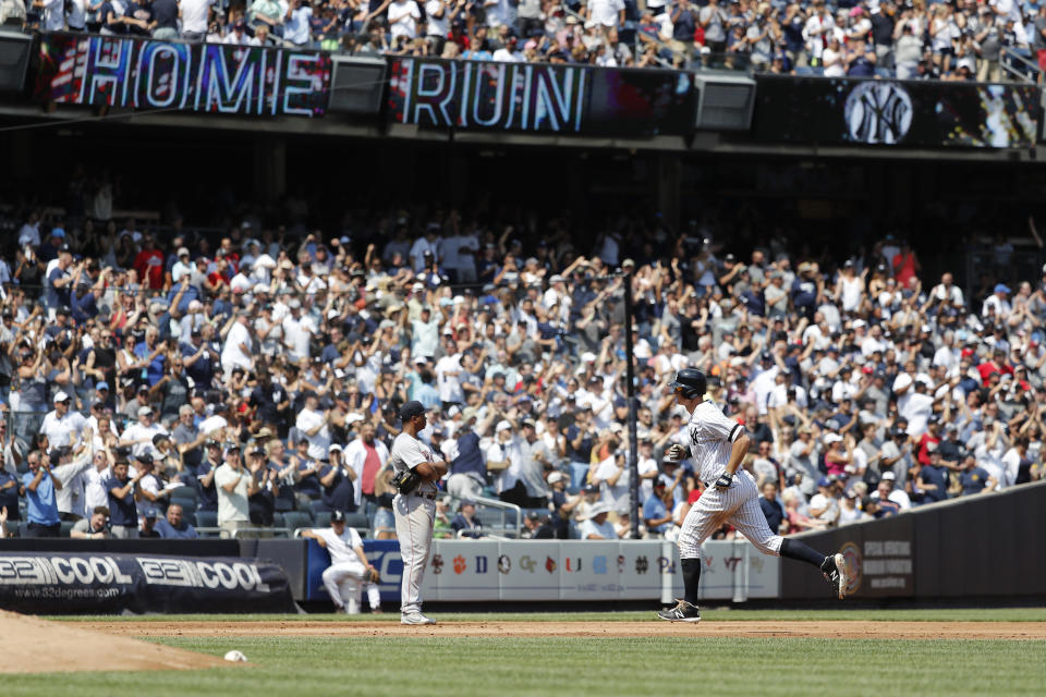 New York Yankees DJ LeMahieu rounds the bases after hitting a three-run home run against the Boston Red Sox in the fourth inning of a baseball game, Saturday, Aug. 3, 2019, in New York. New York Yankees Breyvic Valera and New York Yankees Brett Gardner scored. (AP Photo/Michael Owens)