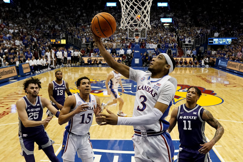 Kansas guard Dajuan Harris Jr. (3) puts up a shot during the first half of an NCAA college basketball game against Kansas State Tuesday, Jan. 31, 2023, in Lawrence, Kan. (AP Photo/Charlie Riedel)