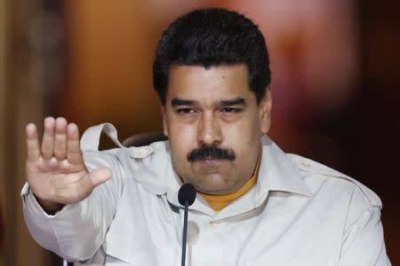 Venezuela's President Nicolas Maduro gestures during a meeting with supporters at Miraflores Palace in Caracas, February 19, 2015. REUTERS/Carlos Garcia Rawlins