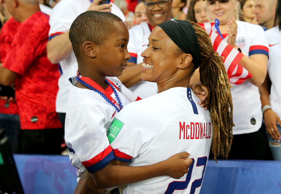 PARIS, FRANCE - JUNE 28:  Jessica McDonald of the USA celebrates with her son following the 2019 FIFA Women's World Cup France Quarter Final match between France and USA at Parc des Princes on June 28, 2019 in Paris, France. (Photo by Maddie Meyer - FIFA/FIFA via Getty Images)