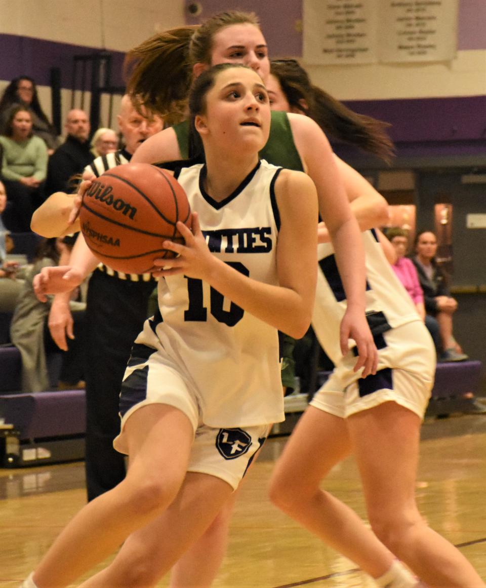 Little Falls Mountie Adriana Izzo drives to the basket against Hamilton during the second half of Wednesday's overtime win in Little Falls.