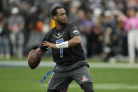 NFC quarterback Geno Smith of the Seattle Seahawks throws a pass during the flag football event at the NFL Pro Bowl against the AFC, Sunday, Feb. 5, 2023, in Las Vegas. (AP Photo/John Locher)