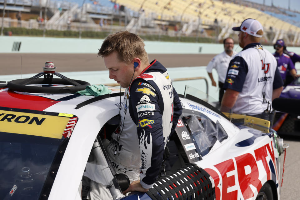 William Byron gets into his car during NASCAR Cup qualifying at Homestead-Miami Speedway, Saturday, Oct. 22, 2022, in Homestead, Fla. (AP Photo/Terry Renna)