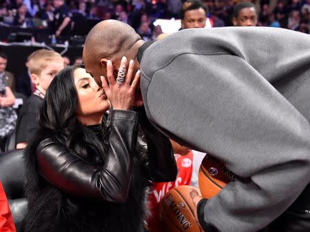 Feb 14, 2016; Toronto, Ontario, CAN; Western Conference forward Kobe Bryant of the Los Angeles Lakers (right) kisses his wife Vanessa Bryant before the NBA All Star Game at Air Canada Centre. Mandatory Credit: Bob Donnan-USA TODAY Sports