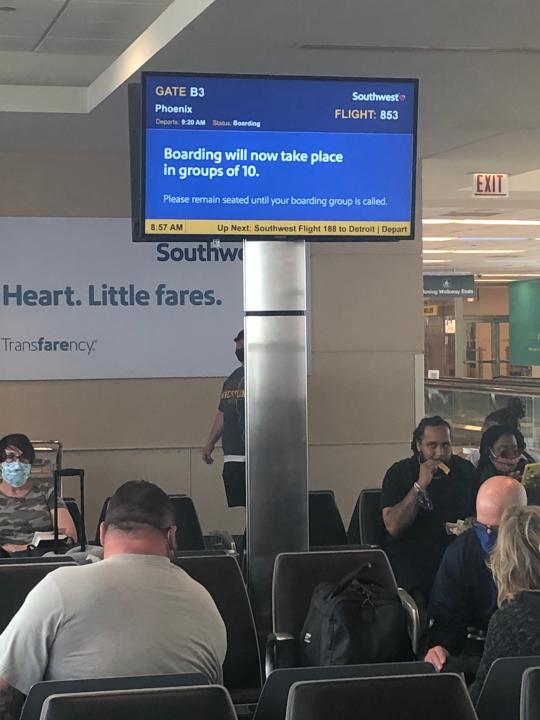 A sign in the gate area at Chicago's Midway Airport details Southwest's new boarding procedure. It is designed to encourage social distancing.