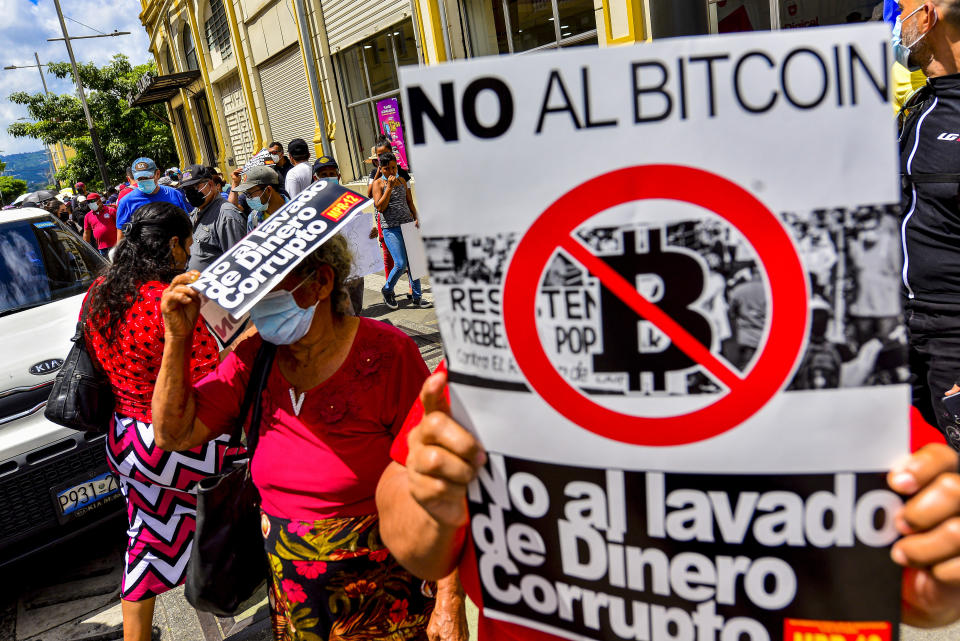 SAN SALVADOR, EL SALVADOR - 2021/09/15: A placard against the government's Bitcoin law, during the protest.
Thousands of Salvadorans took to the streets on El Salvador's Bicentennial Independence Day against El Salvador's President Nayib Bukele and his government's policies. (Photo by Camilo Freedman/SOPA Images/LightRocket via Getty Images)