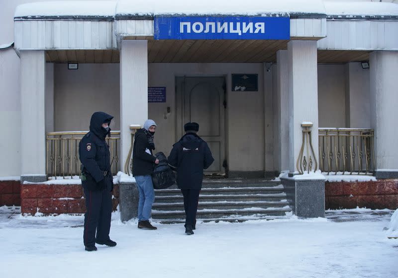 An ally of detained Russian opposition leader Navalny enters a police station, in Khimki