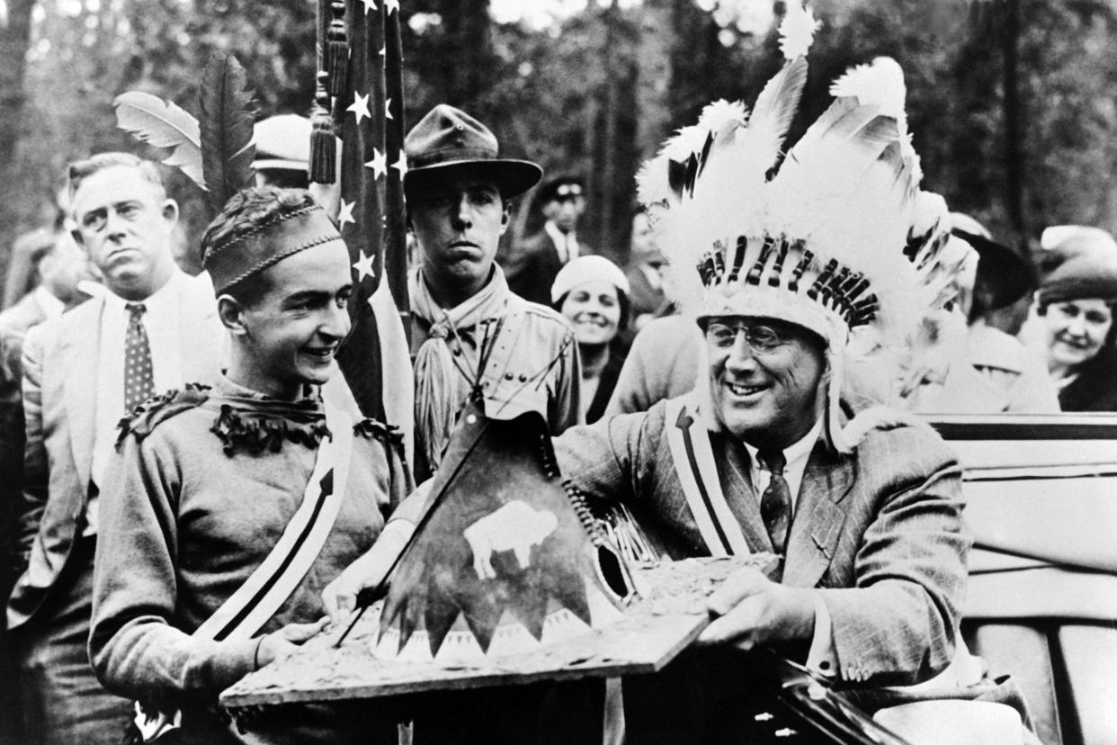 President Franklin Delano Roosevelt receives a miniature wigwam at a Boy Scout camp in New York State in 1933. (Gamma-Keystone via Getty Images)