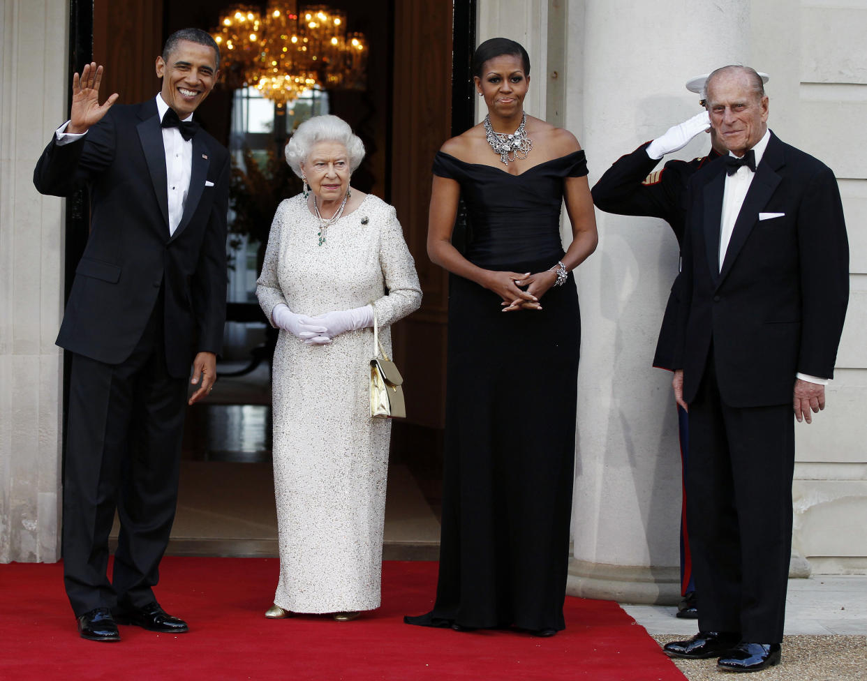 President Barack Obama and first lady Michelle Obama appear with Queen Elizabeth and Prince Philip on a state visit to the U.K. in 2011.