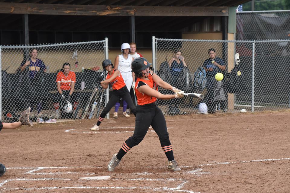 Hudson's Maize Sholl hits an RBI double during Wednesday's Lenawee County Senior All-Star Softball Game at Adrian College.