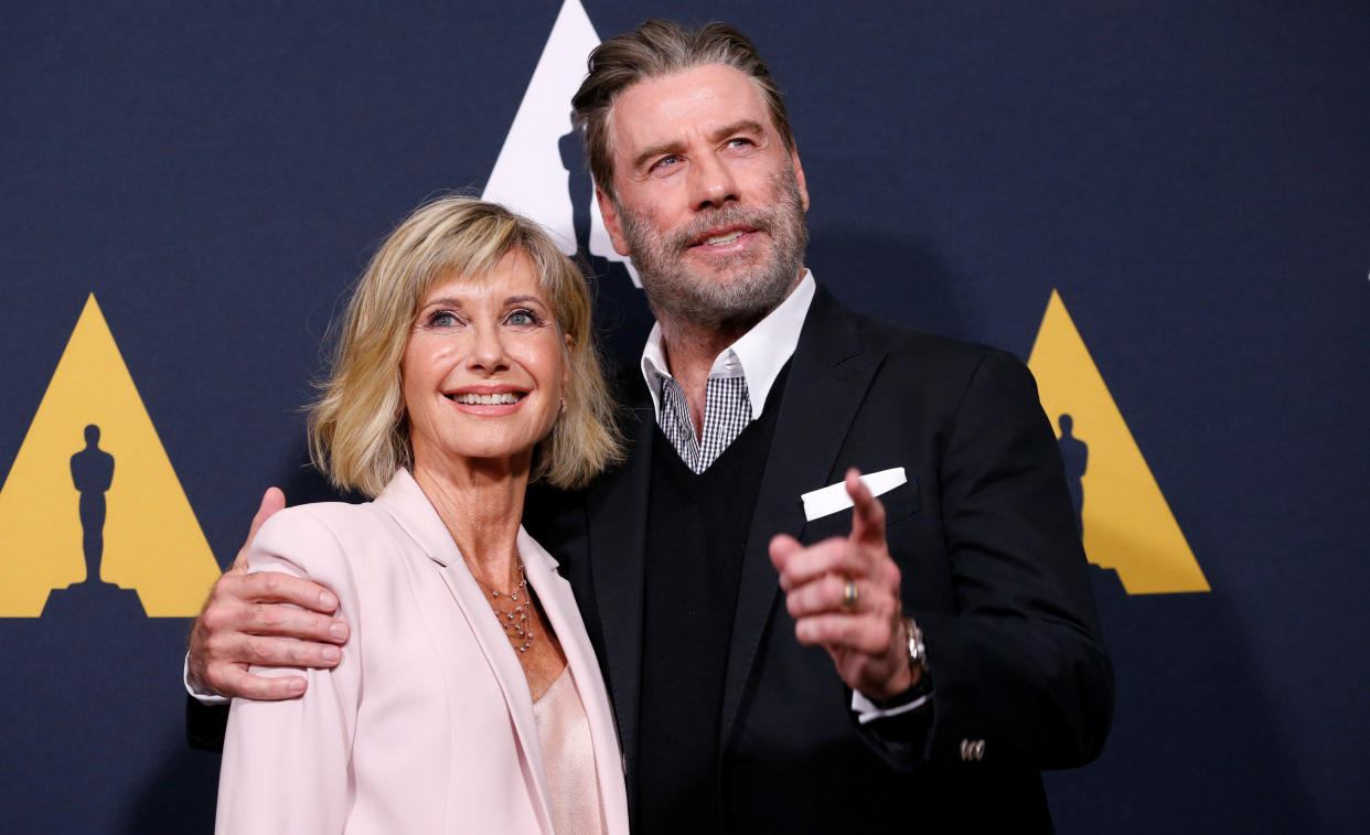 Olivia Newton-John remains close friends with former costar John Travolta, both seen here at a 40th anniversary screening of "Grease" in 2018. "I feel so strongly and so sad for the family," Newton-John says about the recent death of Travolta's wife, Kelly Preston. (Photo: REUTERS/Mario Anzuoni)