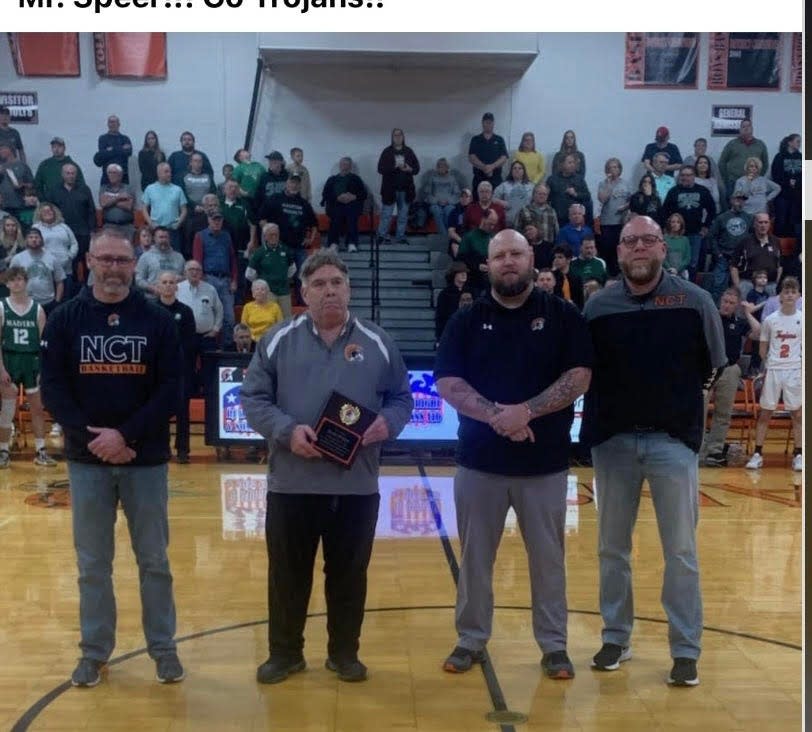 Glenn Speer was recently recognized for his 44 years of service to the basketball teams at Newcomerstown High School. With him are, from left, superintendent Jason Peoples, athletic director Chad Elliott and high school principal Grant Fauver.