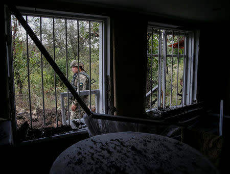 Ukrainian serviceman is seen at his position on the front line near Avdeyevka, Ukraine, August 10, 2016. REUTERS/Gleb Garanich