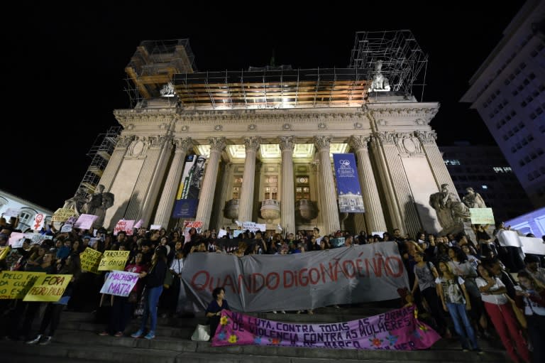 Brazilians protest in front of the Legislative Assembly of Rio de Janeiro (ALERJ) on May 27, 2016, against a gang-rape of a 16-year-old girl