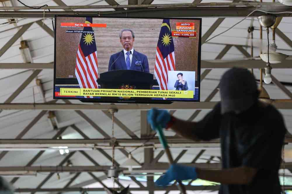 A live broadcast of Prime Minister Tan Sri Muhyiddin Yassin unveiling the RM250 billion stimulus package in Kuala Lumpur March 27, 2020. ― Picture by Yusof Mat Isa