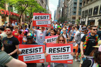 <p>“Resist” signs are held up by participants during the N.Y.C. Pride Parade in New York on June 25, 2017. (Photo: Gordon Donovan/Yahoo News) </p>