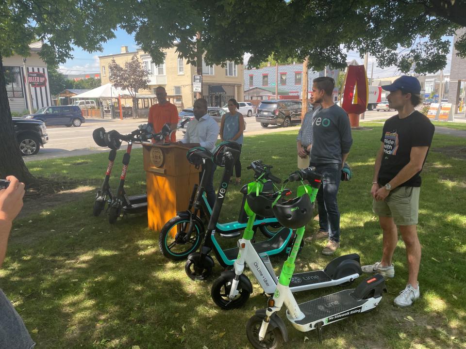 Mayor Cavalier Johnson announces that electric scooters have returned to Milwaukee streets at a news conference Friday in Zillman Park in Bay View.