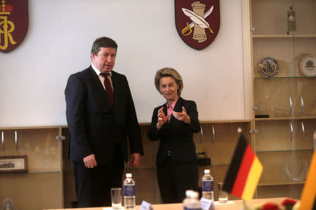 Lithuanian Minister of Defence Raimundas Karoblis (L) talks with his German counterpart Ursula von der Leyen before the ceremony to welcome the German battalion being deployed to Lithuania in Rukla, Lithuania February 7, 2017. Picture taken February 7, 2017. REUTERS/Ints Kalnins