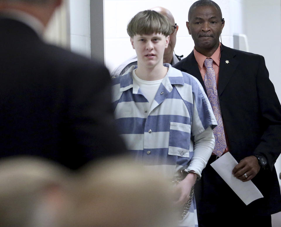 Dylann Roof enters the court room at the Charleston County Judicial Center Monday, April 10, 2017, to enter his guilty plea on murder charges in Charleston, S.C. The convicted Charleston church shooter, Roof was given nine consecutive life sentences in state prison after he pleaded guilty to state murder charges Monday, leaving him to await execution in a federal prison and sparing his victims and their families the burden of a second trial. (Grace Beahm/The Post And Courier via AP, Pool)