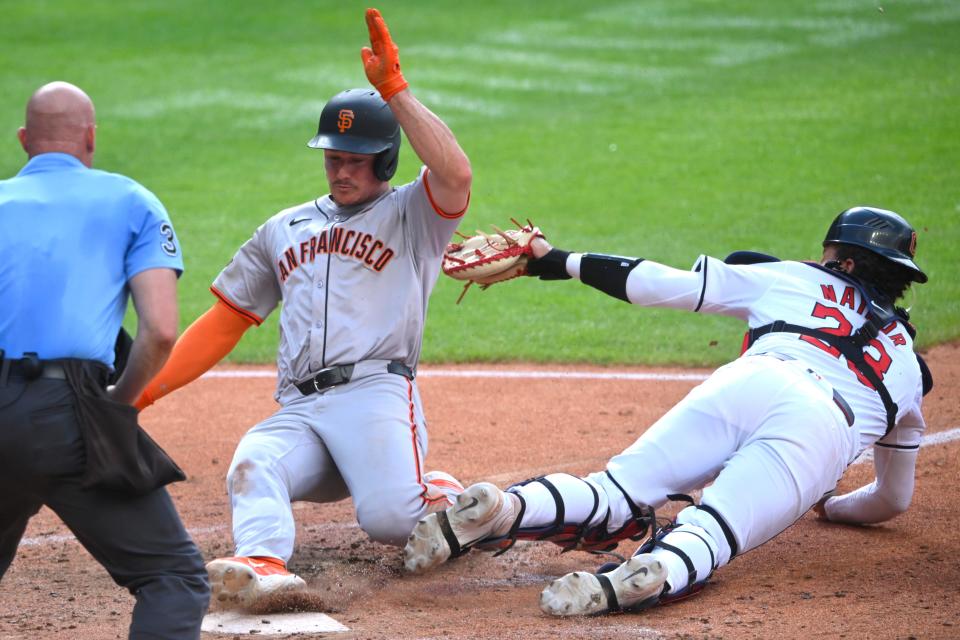 Jul 6, 2024; Cleveland, Ohio, USA; San Francisco Giants third baseman Matt Chapman (26) steals home beside Cleveland Guardians catcher Bo Naylor (23) in the fifth inning at Progressive Field. Mandatory Credit: David Richard-USA TODAY Sports