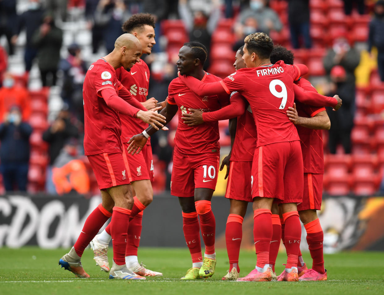 Liverpool's Sadio Mane celebrates scoring their second goal with teammates.