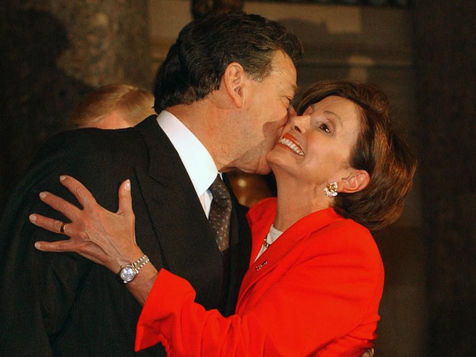 PELOSI SWORN IN AS HOUSE DEMOCRATIC WHIP--Nancy Pelosi, D-Calif., and husband Paul embrace during Pelosi's swearing-in ceremony in Statuary Hall. Outgoing House Minority Whip David Bonior, D-Mich., right, looks on; he is resigning to run for governor in Michigan. In becoming Whip, Pelosi becomes the highest-ranking woman ever in elected office. (Photo by Scott J. Ferrell/Congressional Quarterly/Getty Images)