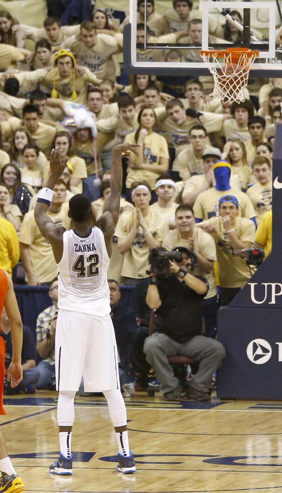 Pittsburgh's Talib Zanna (42) hits a foul shot to give Pittsburgh the lead with just over 4 seconds remaining in an NCAA college basketball game against Syracuse on Wednesday, Feb. 12, 2014, in Pittsburgh. Syracuse made a 3-point shot with less than a second left and won 58-56. (AP Photo/Keith Srakocic)