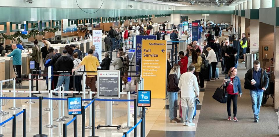 Travellers form a line at the Southwest Airlines ticket counter on Tuesday, Dec. 27, 2022 at Sarasota-Bradenton International Airport.