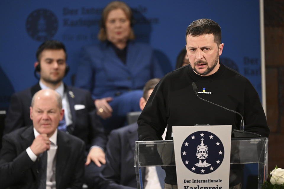 Ukrainian President Volodymyr Zelenskyy delivers a speech after he received the Charlemagne Prize for Services to European Unity in Aachen, Germany, Sunday, May 14, 2023. Zelenskyy is in Aachen to receive the International Charlemagne Prize, awarded to him and the people of Ukraine. (Federico Gambarini/DPA via AP, Pool)