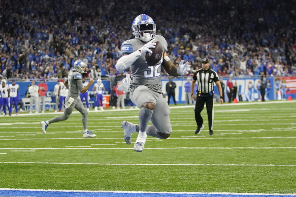 Detroit Lions running back D'Andre Swift runs into the end zone for a two-point conversion during the second half of an NFL football game against the Buffalo Bills, Thursday, Nov. 24, 2022, in Detroit. (AP Photo/Paul Sancya)