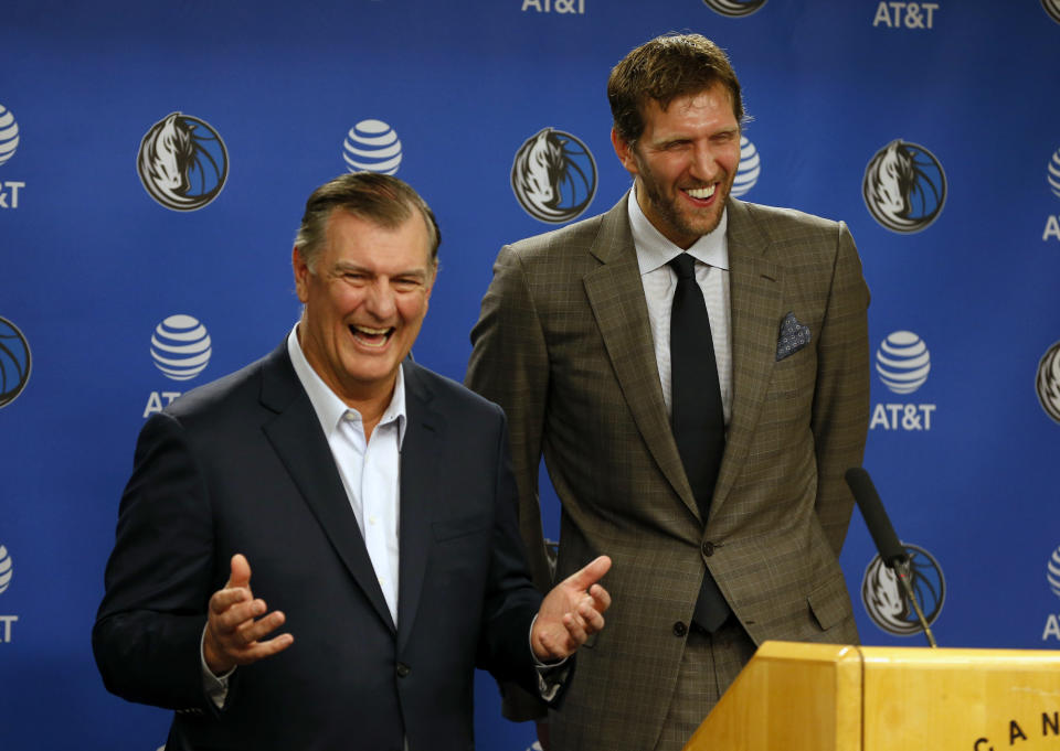 Dallas Mayor Mike Rawlings, left, and Dallas Mavericks player Dirk Nowitzki talk to the media about Nowitzki receiving the key to the city during a news conference prior to an NBA basketball game in Dallas, Wednesday, Nov. 21, 2018. (AP Photo/Michael Ainsworth)