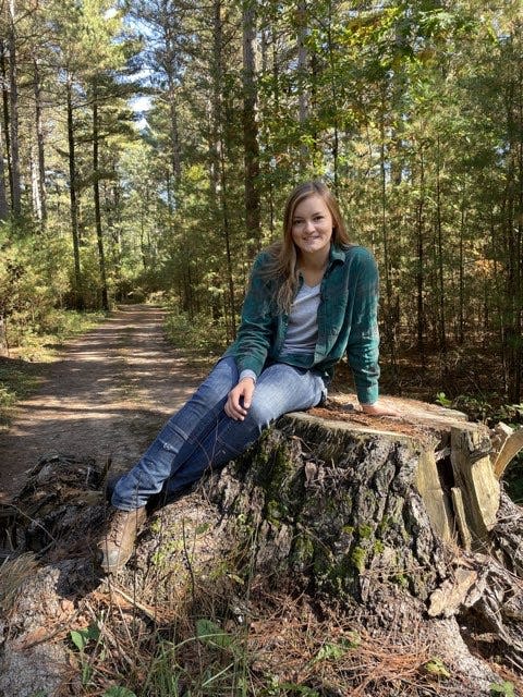 Violet Thielke, pictured in 2021 in Waupaca, grew up working with her dad, Michael Thielke, at their family-owned business, Thielke Forestry Products. Now 23 years old, Violet Thielke said she plans to continue working in the forestry industry.