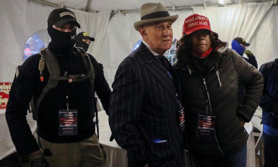 Members of the Oath Keepers provide security to Roger Stone in Washington DC on 5 January.