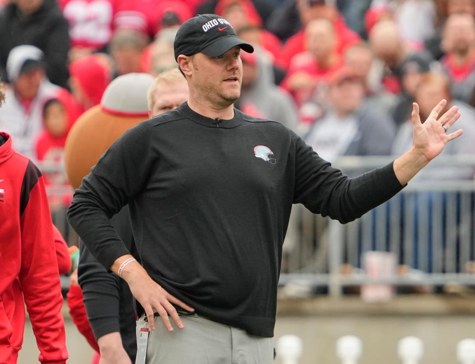 Ohio State offensive line coach Justin Frye gives instructions during the spring game on April 16.