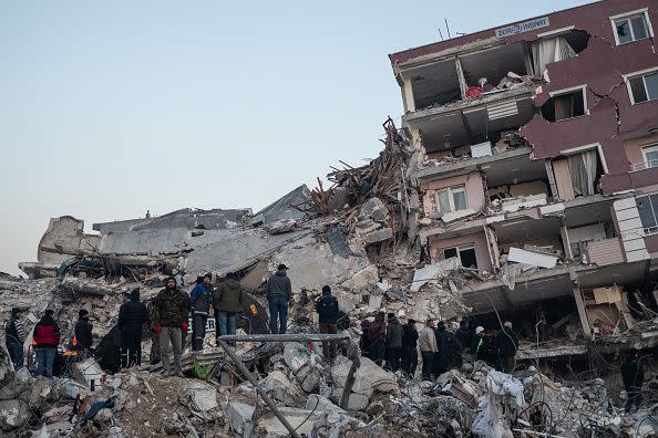 HATAY, TURKEY - FEBRUARY 09: People wait for news of their loved ones, believed to be trapped under collapsed building on  on February 09, 2023 in Hatay, Turkey. A 7.8-magnitude earthquake hit near Gaziantep, Turkey, in the early hours of Monday, followed by another 7.5-magnitude tremor just after midday. The quakes caused widespread destruction in southern Turkey and northern Syria and were felt in nearby countries. (Photo by Burak Kara/Getty Images)