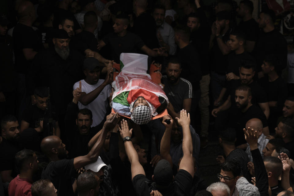 Mourners carry the body of Palestinian militant Abdullah Abu Hamdan, 24, during his funeral in the Balata refugee camp near the West Bank town of Nablus Monday, May 22, 2023. The Israeli military raided the camp early Monday, sparking a firefight that killed Abu Hamdan and two other Palestinian militants. (AP Photo/Majdi Mohammed)