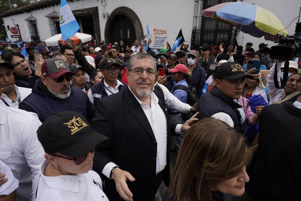 President-elect Bernardo Arévalo, center, leads a march in protest of government interference in the elections he won in August in Guatemala City, Thursday, Dec. 7, 2023. Arévalo is set to take office on Jan. 14, 2024. (AP Photo/Moises Castillo)