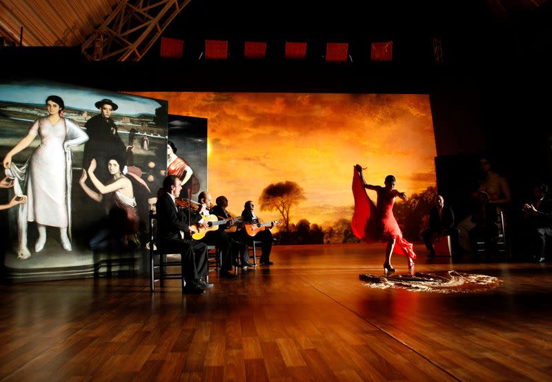 FILE PHOTO: Flamenco dancer Sara Baras performs next to flamenco singers and guitarists during the filming of "Flamenco, Flamenco" in the Andalusian capital of Seville