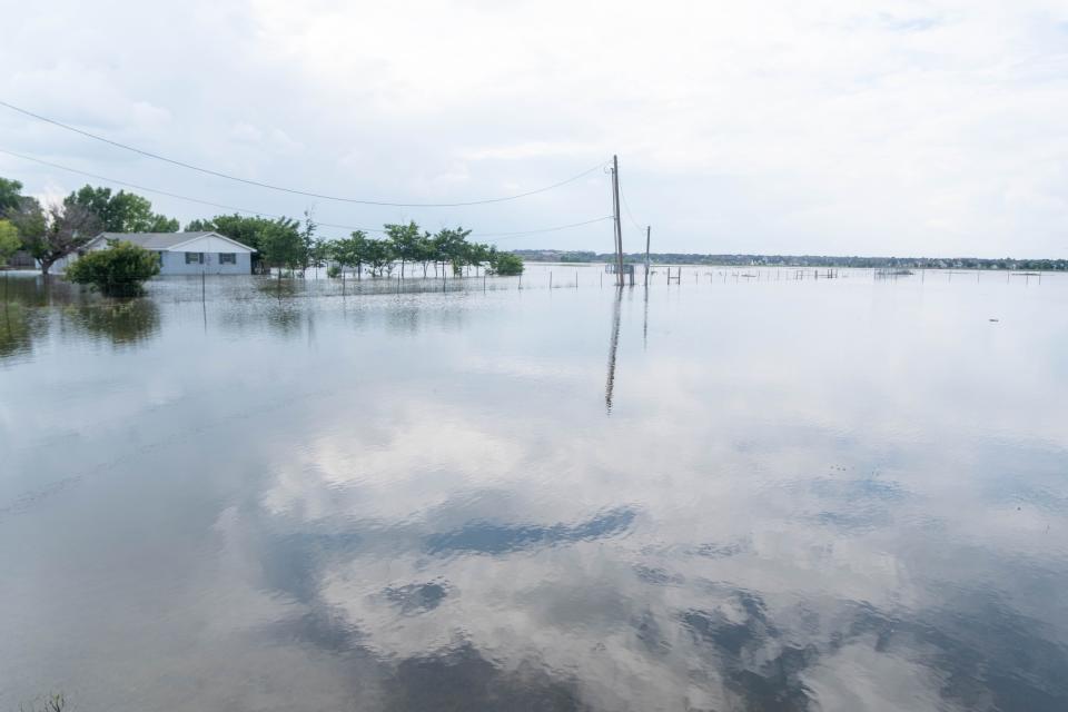 Flooded house of Mary Puckett Monday on 77th Street near Amarillo across from Greenways.