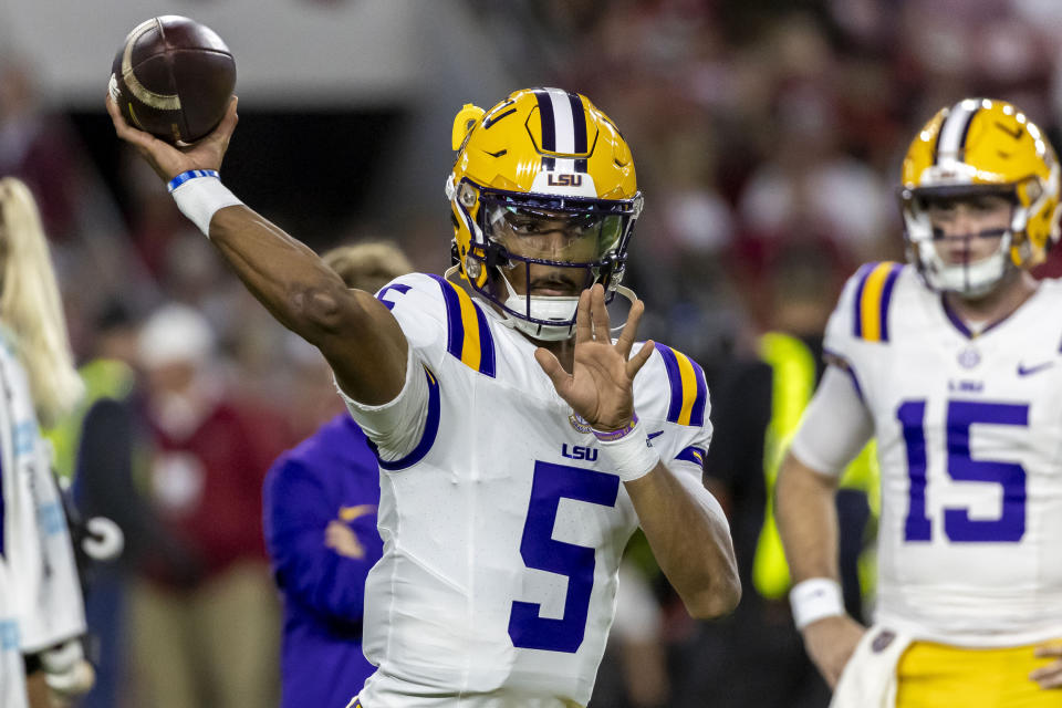 LSU quarterback Jayden Daniels (5) warms up before an NCAA college football game against Alabama, Saturday, Nov. 4, 2023, in Tuscaloosa, Ala. (AP Photo/Vasha Hunt)