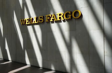 The sign outside the Wells Fargo & Co. bank in downtown Denver April 13, 2016. REUTERS/Rick Wilking/File Photo