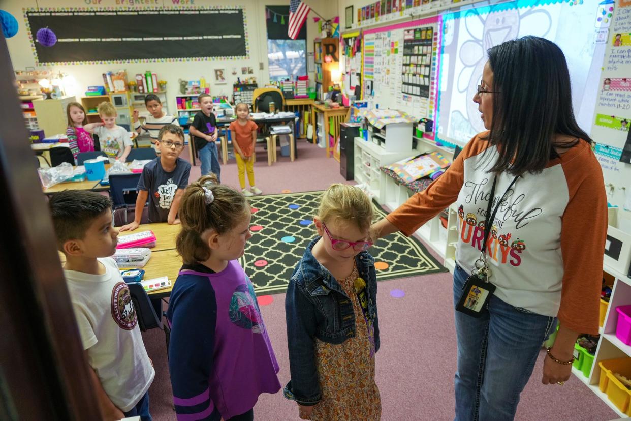 Kindergarten teacher Monica Ramirez walks her students in Granger to lunch. School districts around Texas were expecting a funding boost from the Legislature, given the state's considerable budget surplus, but those expected increases haven't come because public school funding has become entangled with Gov. Greg Abbott's push for school choice legislation.