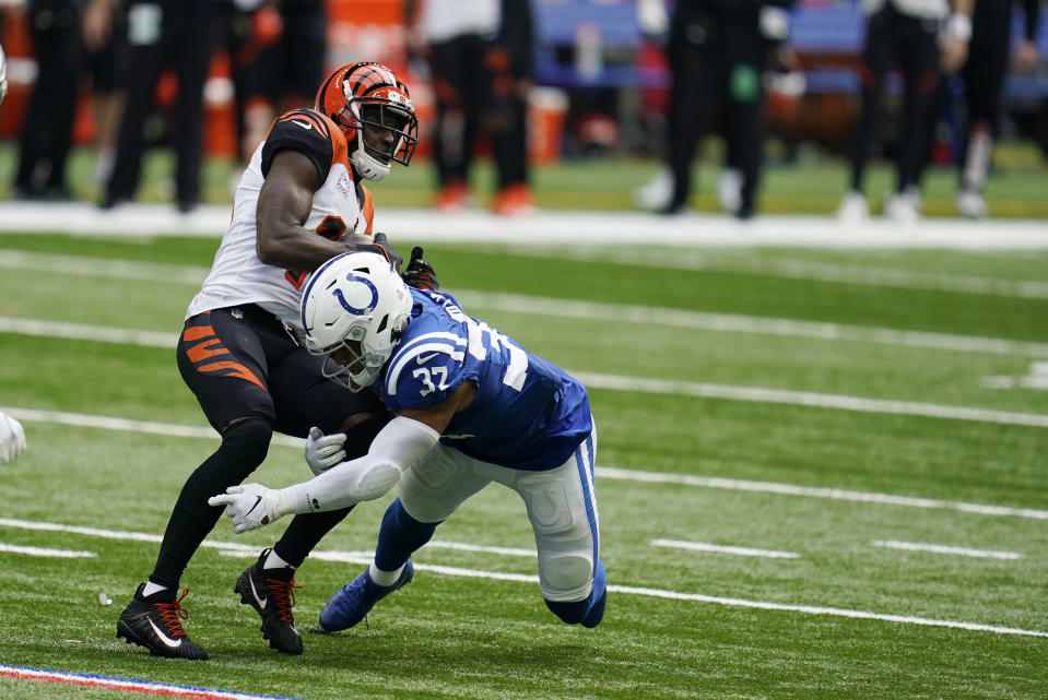 Cincinnati Bengals' A.J. Green, top, is tackled by Indianapolis Colts' Khari Willis (37) during the second half of an NFL football game, Sunday, Oct. 18, 2020, in Indianapolis. (AP Photo/Michael Conroy)