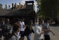 Teenagers visit the former Nazi German death camp Auschwitz-Birkenau in Oswiecim, Poland, Wednesday, May 10, 2023. (AP Photo/Michal Dyjuk)